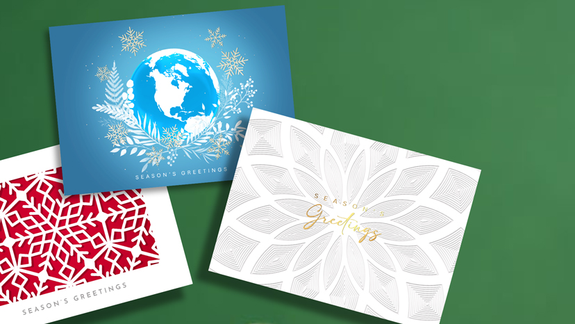 Blue and green custom greeting cards textured with letterpress printing featuring words "Business Christmas Cards"
